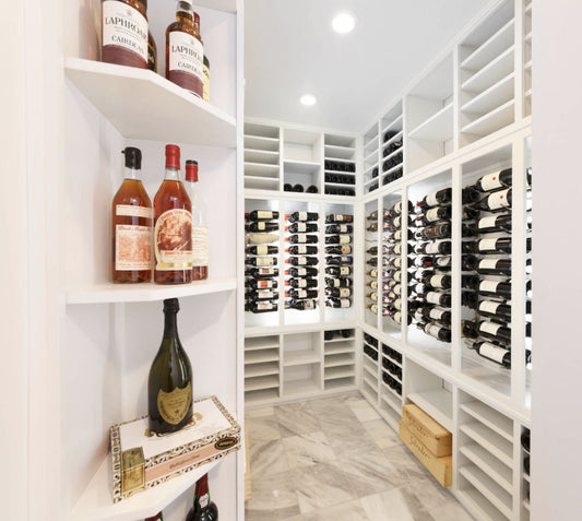 Wine racks into converted closet space now a wine cellar