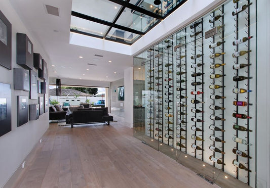 Corridor of wine cellar wall behind glass