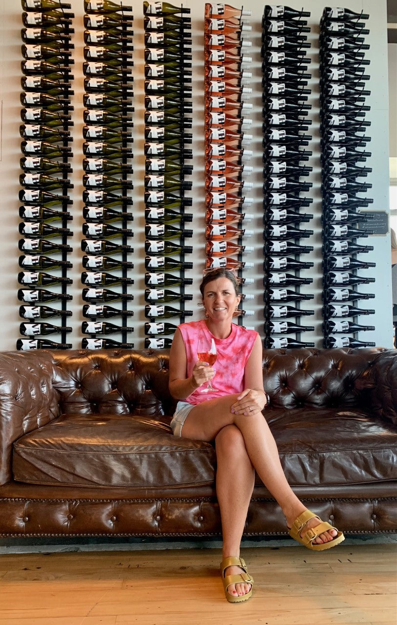 Anita at Volcanic Hills in front of VintageView wine racks