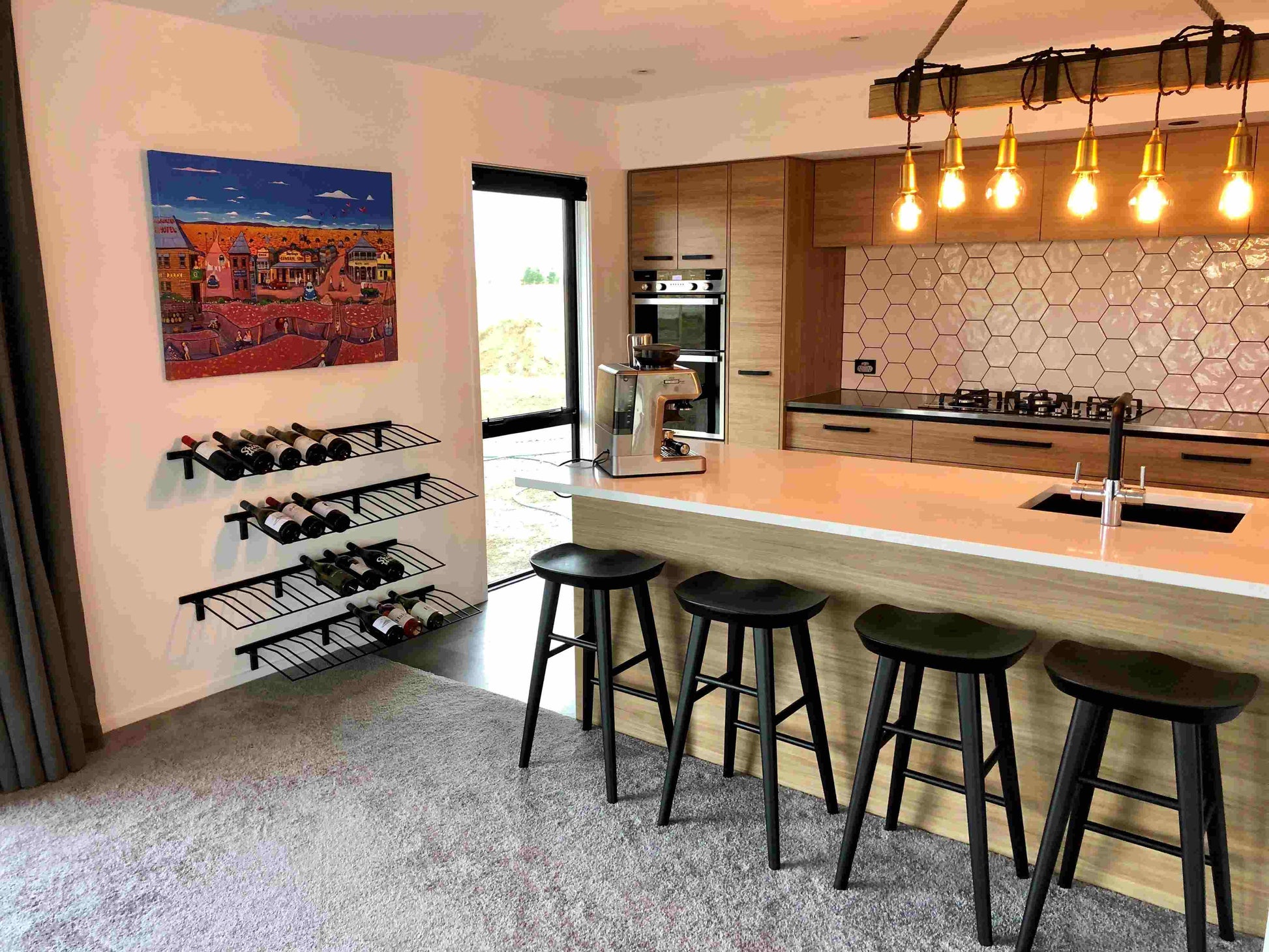 Horizontal presentation wine racks in kitchen on a wall, black metal