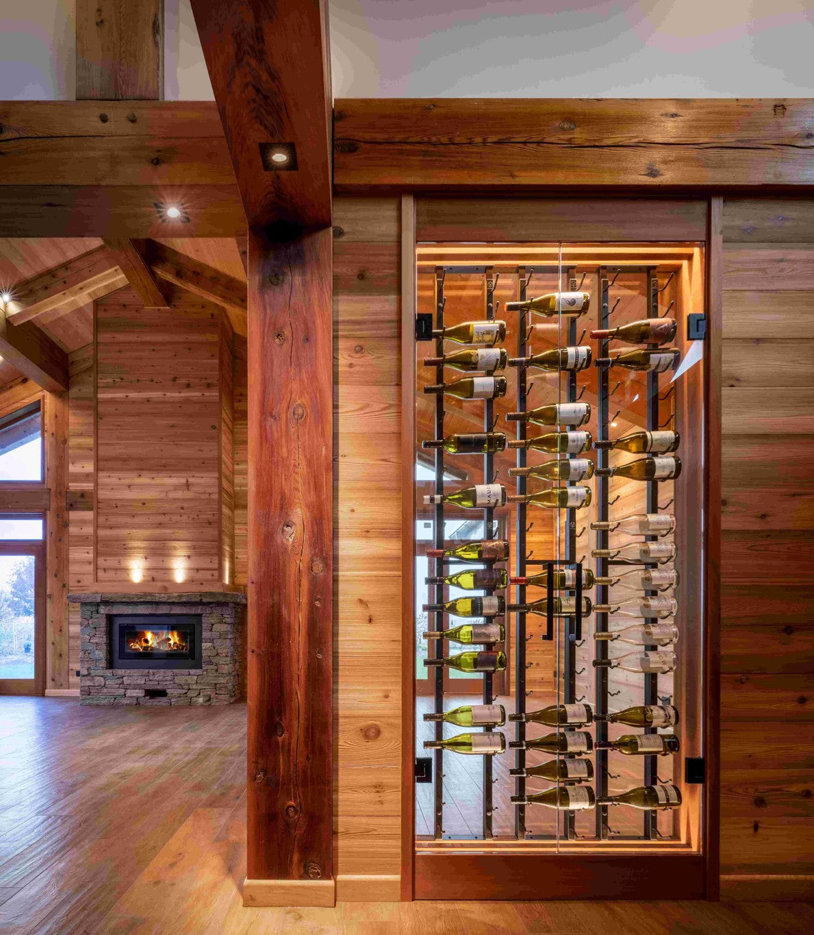 wine cellar with floor to ceiling frame inside glass enclosure for modern wine racking