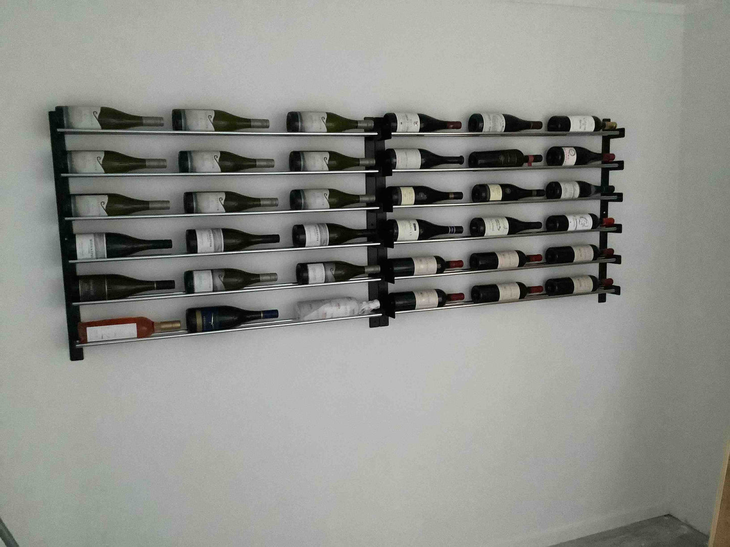 Evolution wine wall display label forward bottles