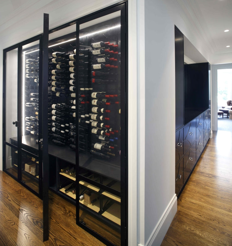 Modern wine cellar with glass doors in a home setting