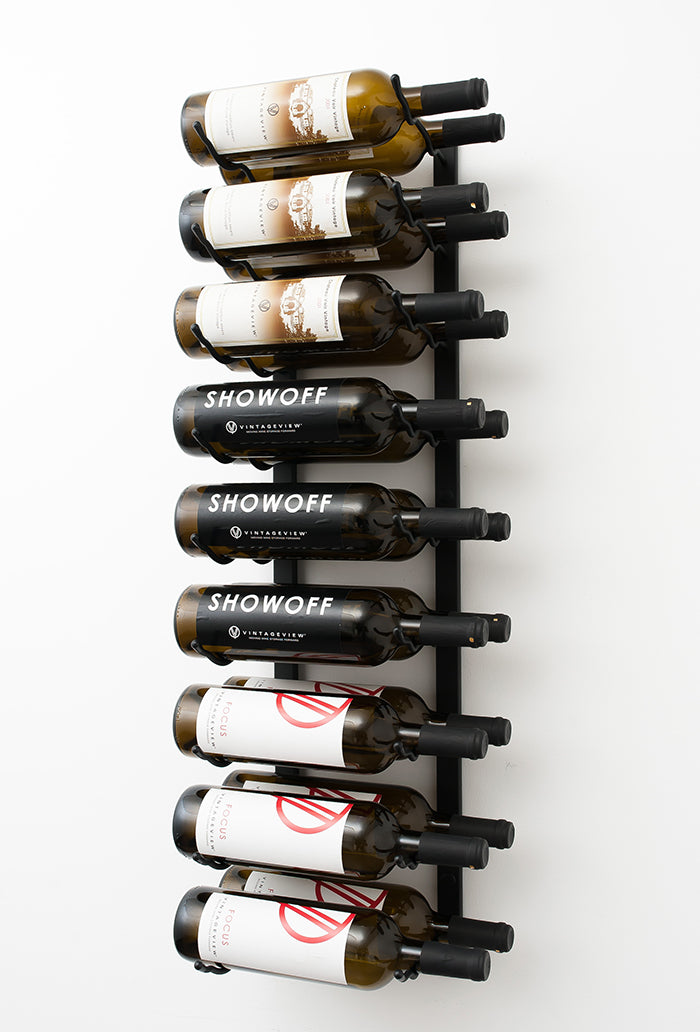A wall mounted metal wine rack holding 18 bottles of wine 