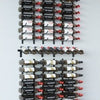 Wine wall kit with wall mounted black metal wine racks and presentation horizontal rack in middle