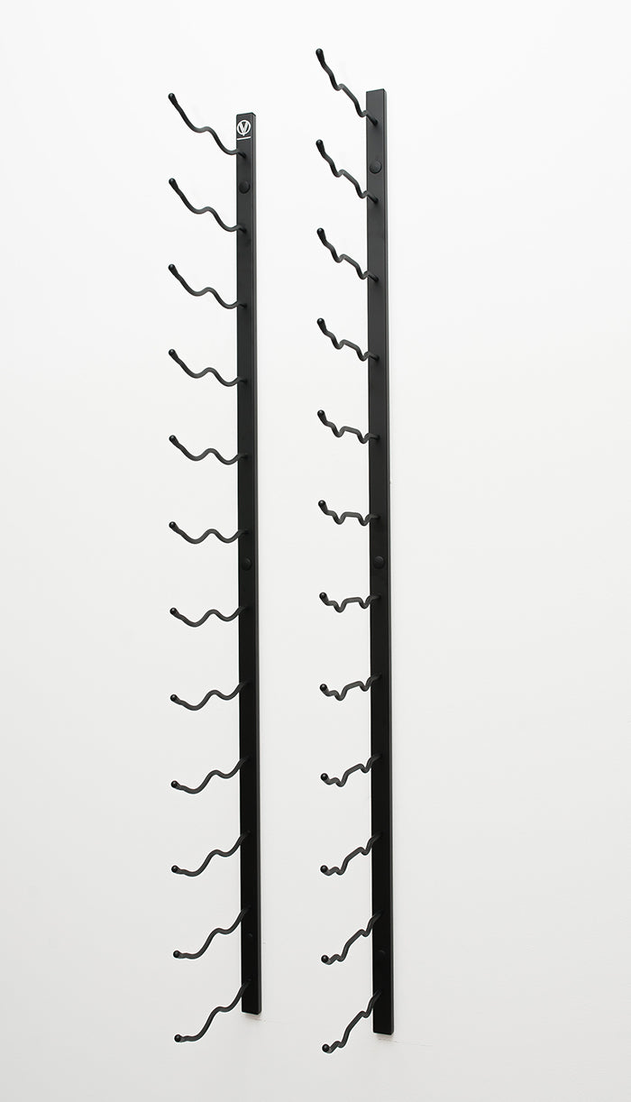 An empty metal wall mounted wine rack that holds 24 wine bottles